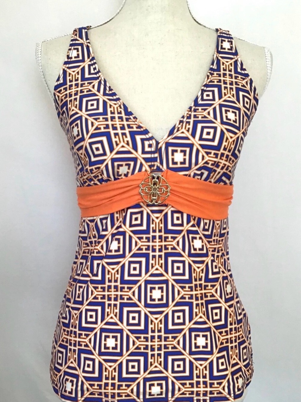 Antonio Melani tankini set features a blue and orange geometric patten, broach